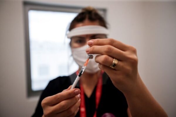 a nurse prepares a dose of the pfizer biontech coronavirus disease (covid 19) vaccine at ankara city hospital in ankara